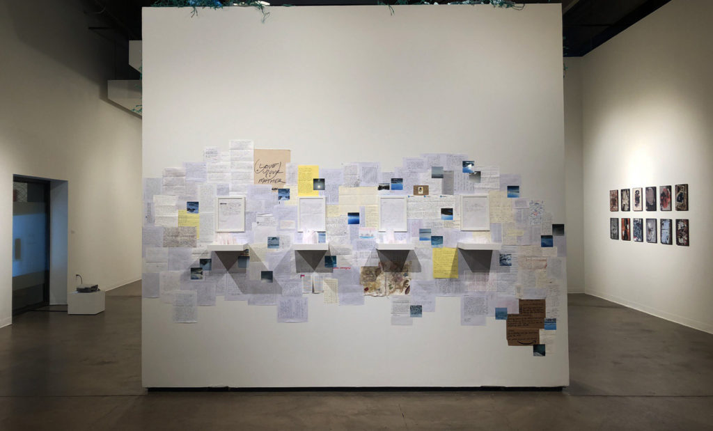 Regan 2 Everything is Fine. Ghost nets, ocean debris, 150 letters, 3D printed PLA sculptures, shelves, arctic photos. 12 x 12 feet (each side of wall). 2020.